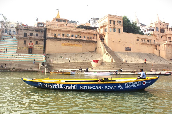 Traditional wooden boat beside the Varanasi ghats