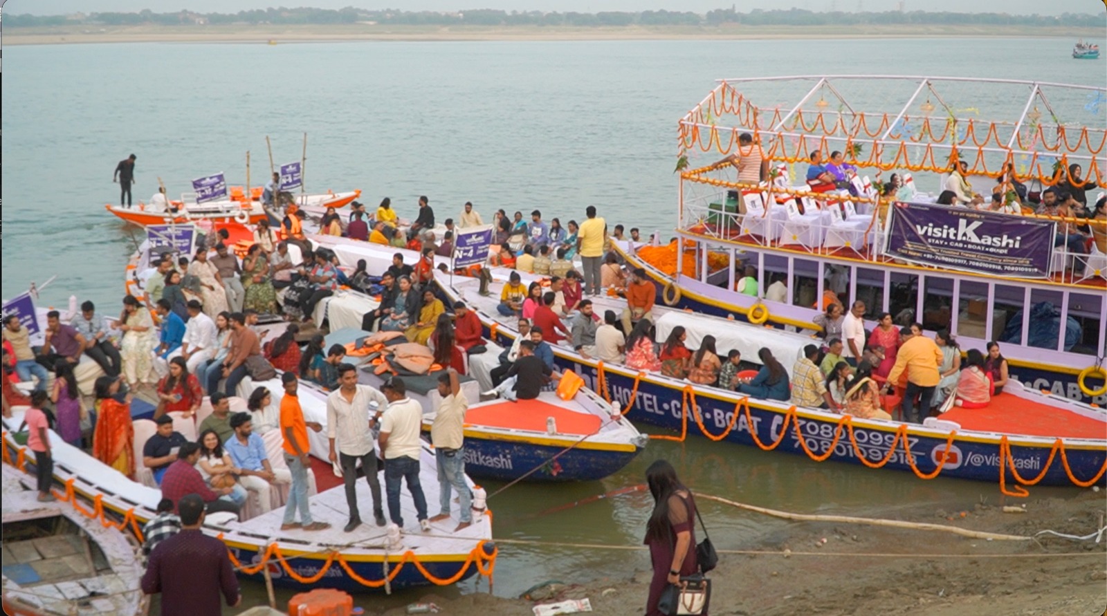 Normal Motor Boat N-4 alongside the visitKashi boat at the ghat