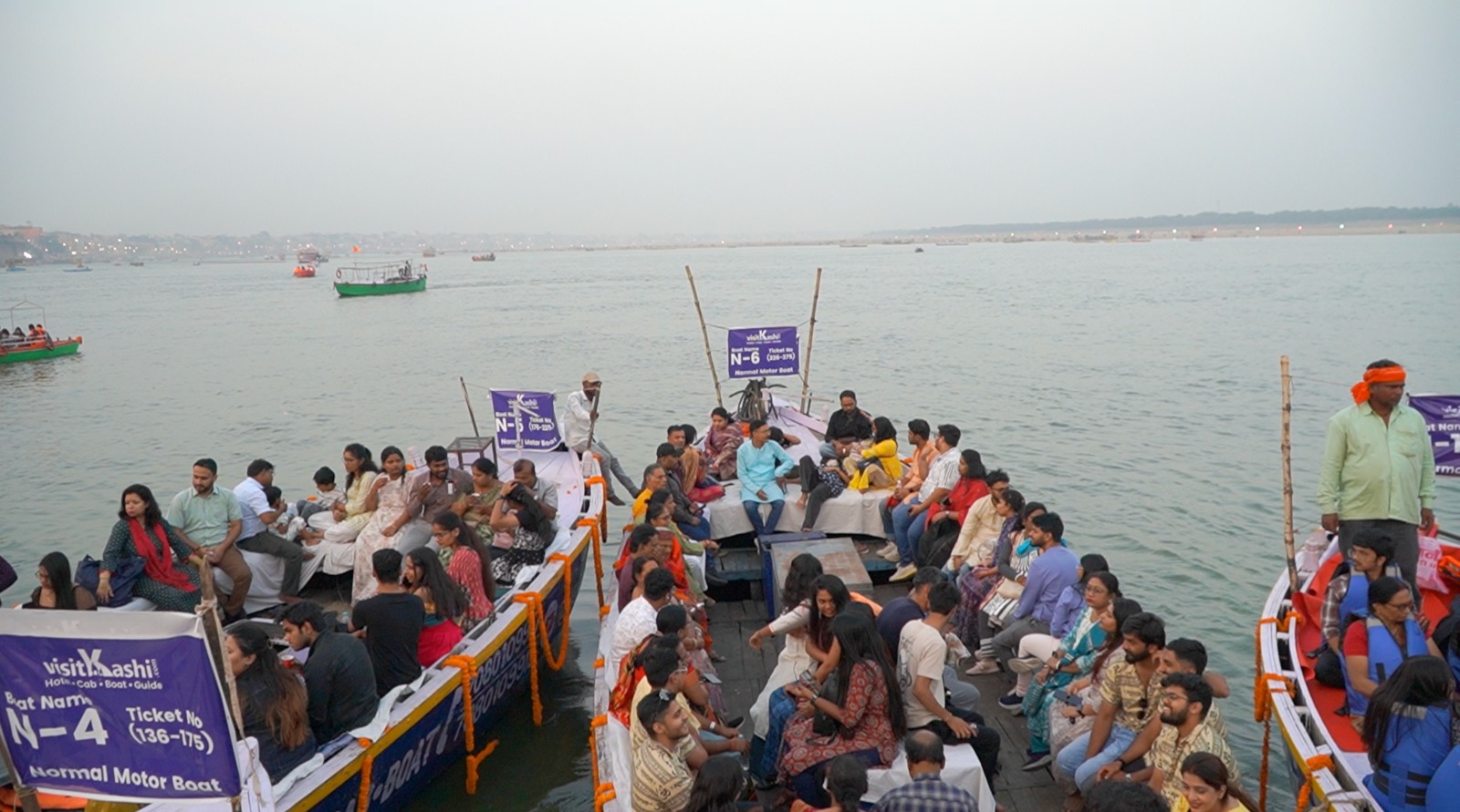 Guests seated on Normal Motor Boats N-4, N-5 and N-6 on the Ganga